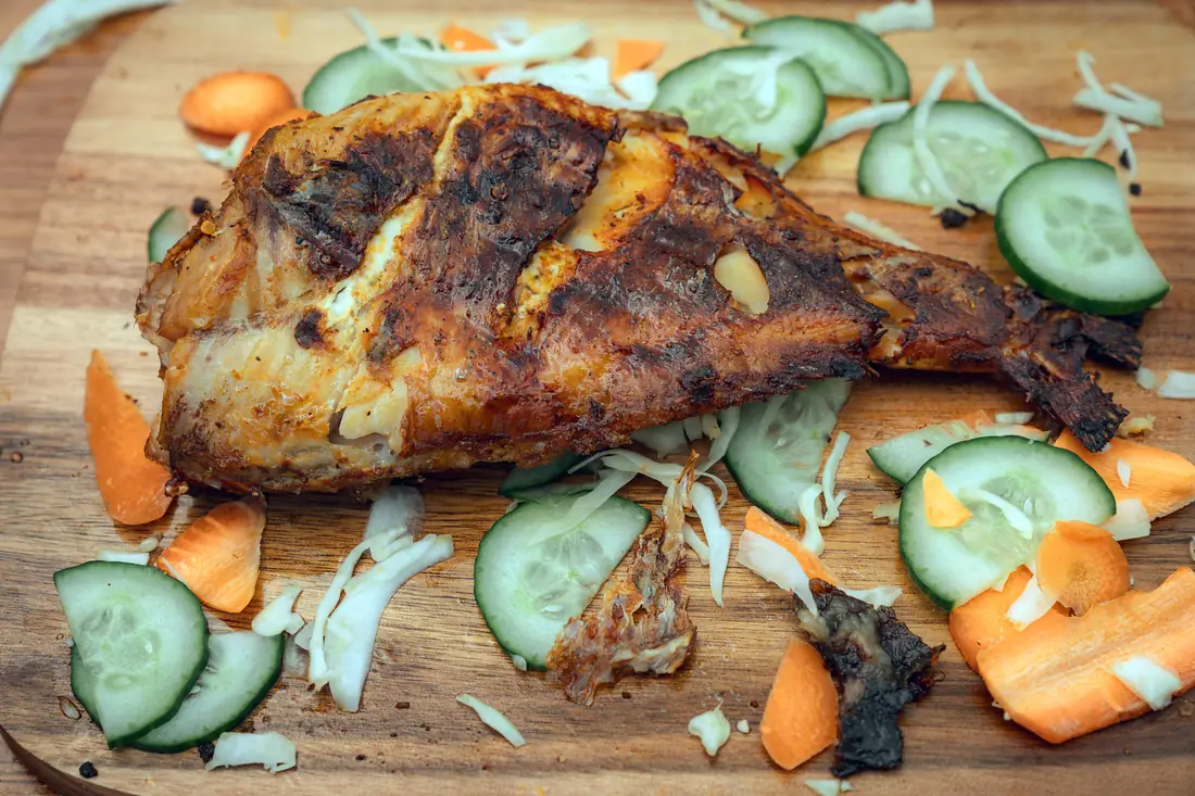 Grilled fish served with fresh salad